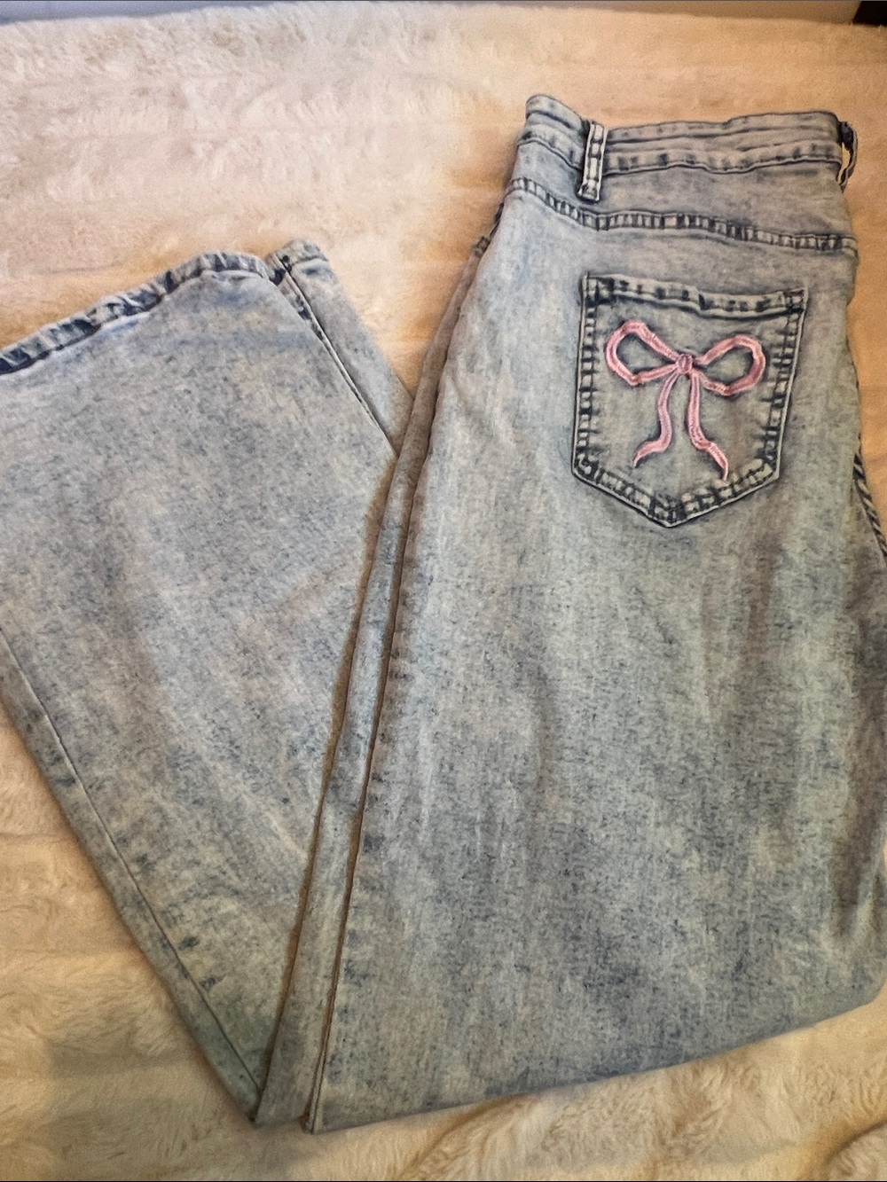 Women’s Acid Wash Light Blue Jeans with Pink Bow Pocket Detail